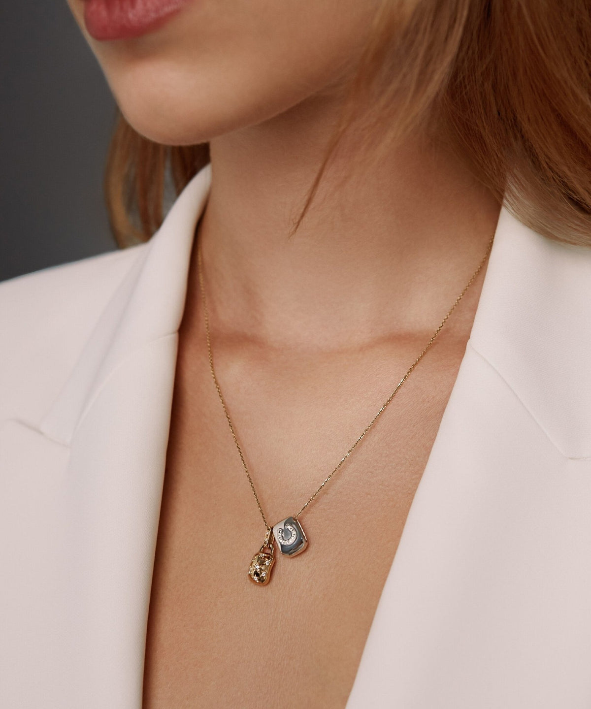 AMULETHA symbolic luxury jewelry gifting - Horseshoe Amulet - sterling silver with diamonds - closeup