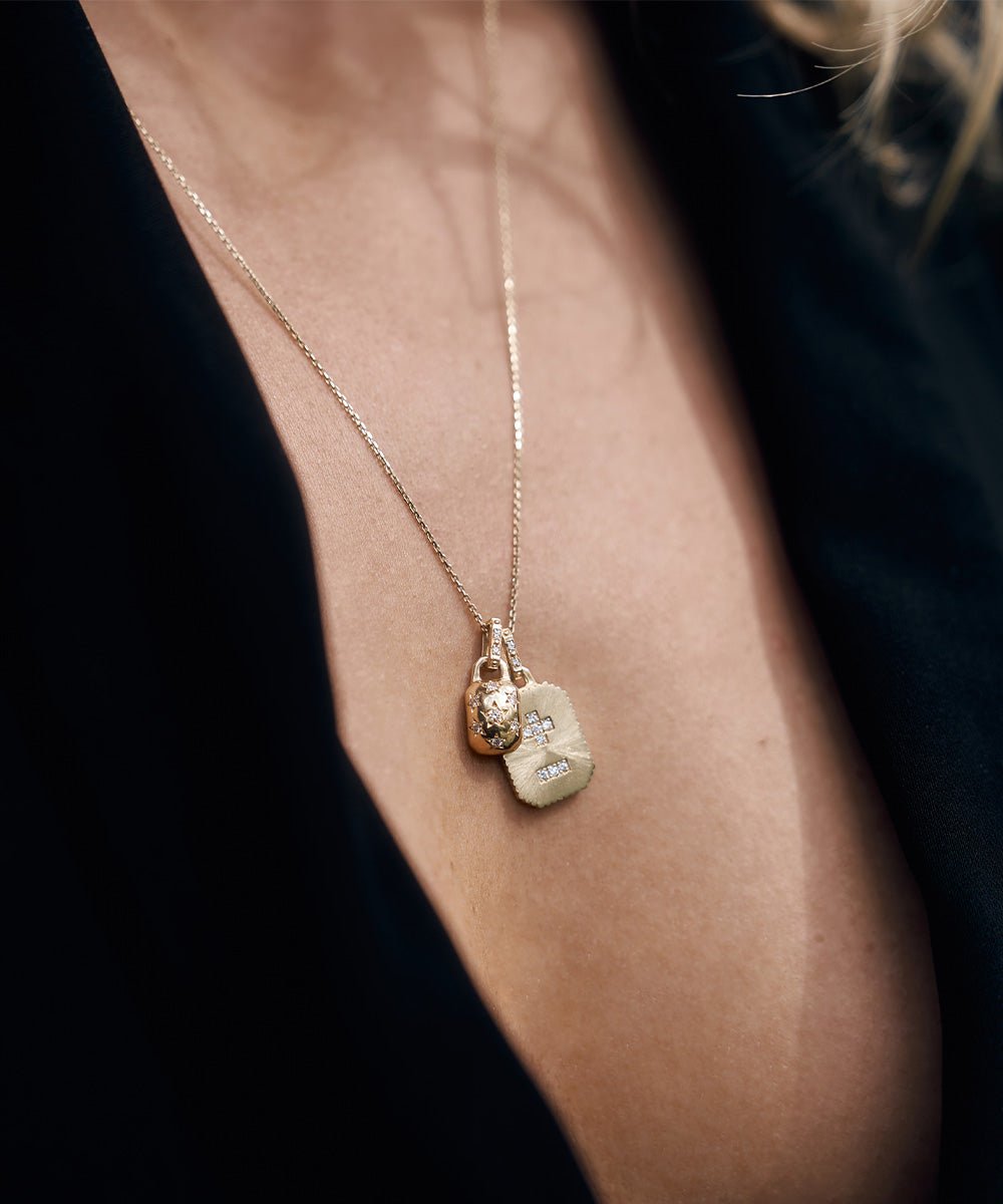 AMULETHA symbolic luxury jewelry gifting - Qu'Hier Que Demain Amulet - sterling silver with diamonds - closeup